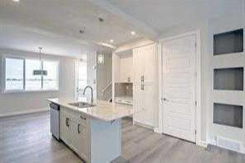 157 Cobblestone Gate Sw, Airdrie, AB - Indoor Photo Showing Kitchen With Upgraded Kitchen