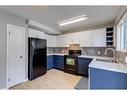 36 Deerpoint Road Se, Calgary, AB  - Indoor Photo Showing Kitchen With Double Sink 