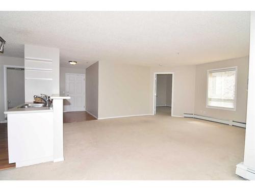 211-270 Shawville Way Se, Calgary, AB - Indoor Photo Showing Other Room With Fireplace