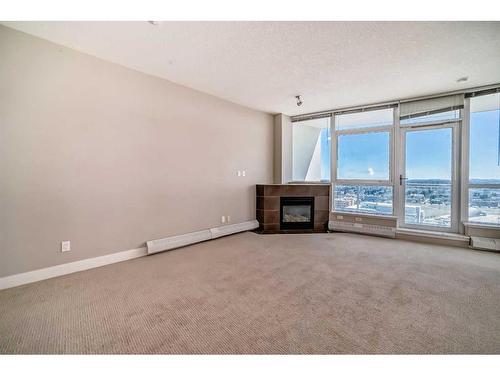 1803-77 Spruce Place Sw, Calgary, AB - Indoor Photo Showing Other Room With Fireplace