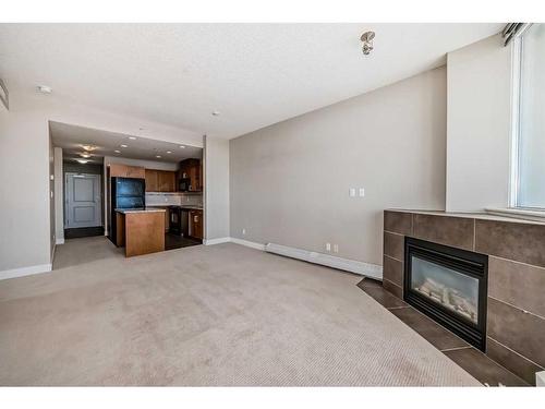 1803-77 Spruce Place Sw, Calgary, AB - Indoor Photo Showing Living Room With Fireplace