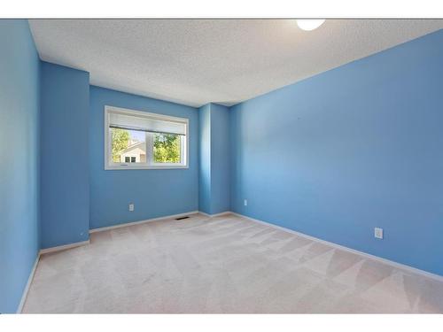 100-388 Sandarac Drive Nw, Calgary, AB - Indoor Photo Showing Other Room