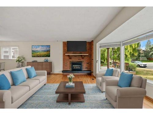 11408 Wilcox Street Se, Calgary, AB - Indoor Photo Showing Living Room With Fireplace