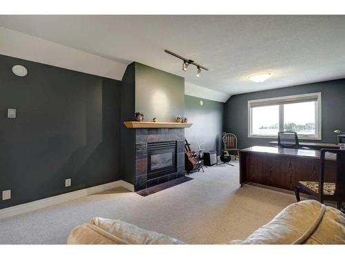 242132 88 Street East, Rural Foothills County, AB - Indoor Photo Showing Living Room With Fireplace