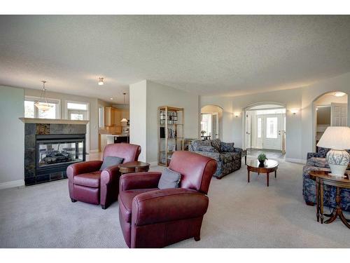 242132 88 Street East, Rural Foothills County, AB - Indoor Photo Showing Living Room With Fireplace