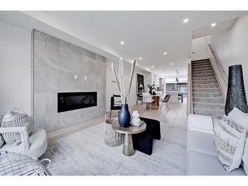 5-3404 8 Avenue Sw, Calgary, AB - Indoor Photo Showing Living Room With Fireplace