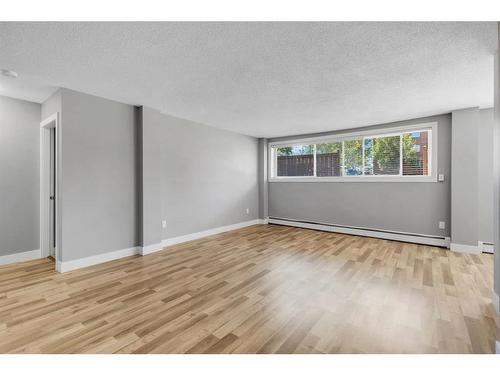 116-1411 7 Avenue Nw, Calgary, AB - Indoor Photo Showing Other Room