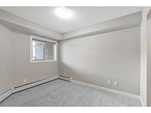 9110-403 Mackenzie Way Sw, Airdrie, AB - Indoor Photo Showing Other Room