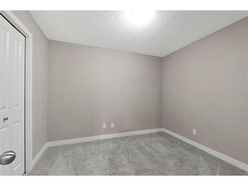 9110-403 Mackenzie Way Sw, Airdrie, AB - Indoor Photo Showing Other Room