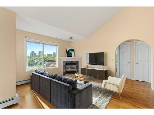 404-1110 17 Street Sw, Calgary, AB - Indoor Photo Showing Living Room With Fireplace