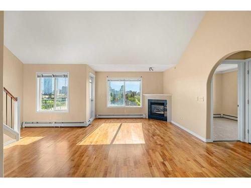 404-1110 17 Street Sw, Calgary, AB - Indoor Photo Showing Other Room With Fireplace