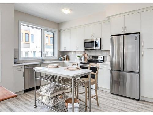 106-1453 Na'A Drive Sw, Calgary, AB - Indoor Photo Showing Kitchen