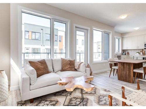 106-1453 Na'A Drive Sw, Calgary, AB - Indoor Photo Showing Living Room