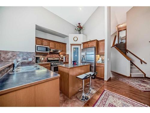 151 Bridlemeadows Common Sw, Calgary, AB - Indoor Photo Showing Kitchen With Double Sink