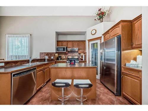 151 Bridlemeadows Common Sw, Calgary, AB - Indoor Photo Showing Kitchen With Double Sink