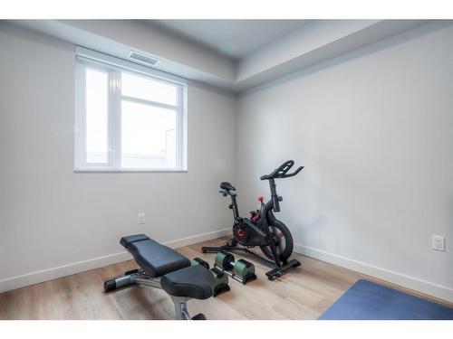 304-1107 Gladstone Road Nw, Calgary, AB - Indoor Photo Showing Gym Room