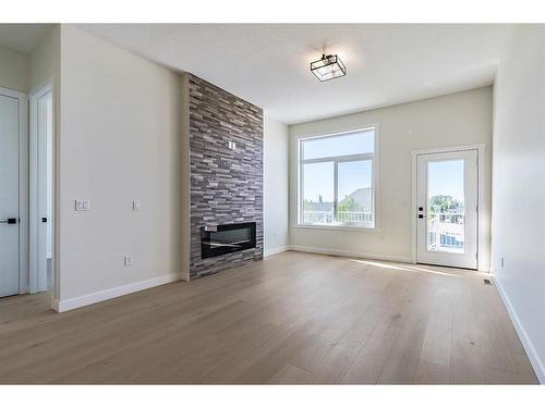 11 Wolf Crescent, Okotoks, AB - Indoor With Fireplace