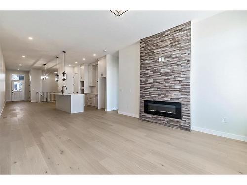 11 Wolf Crescent, Okotoks, AB - Indoor Photo Showing Living Room With Fireplace