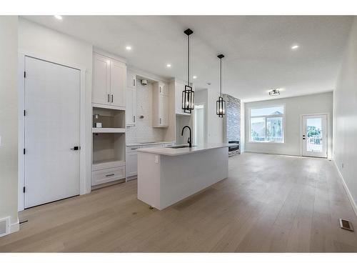 11 Wolf Crescent, Okotoks, AB - Indoor Photo Showing Kitchen With Upgraded Kitchen