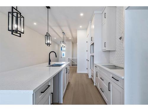 11 Wolf Crescent, Okotoks, AB - Indoor Photo Showing Kitchen With Double Sink With Upgraded Kitchen