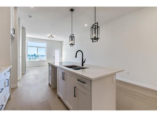 11 Wolf Crescent, Okotoks, AB - Indoor Photo Showing Kitchen With Double Sink With Upgraded Kitchen