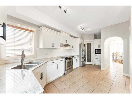 212A 12A Street Ne, Calgary, AB - Indoor Photo Showing Kitchen With Double Sink With Upgraded Kitchen