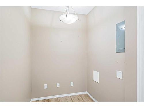 206-6315 Ranchview Drive Nw, Calgary, AB - Indoor Photo Showing Kitchen With Fireplace With Stainless Steel Kitchen