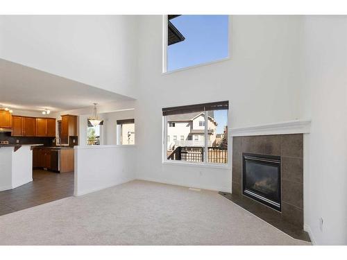 208 East Lakeview Place, Chestermere, AB - Indoor Photo Showing Living Room With Fireplace