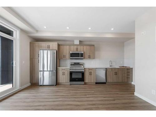 2308-55 Lucas Way Nw, Calgary, AB - Indoor Photo Showing Kitchen With Stainless Steel Kitchen