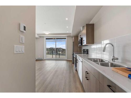 2308-55 Lucas Way Nw, Calgary, AB - Indoor Photo Showing Kitchen With Double Sink