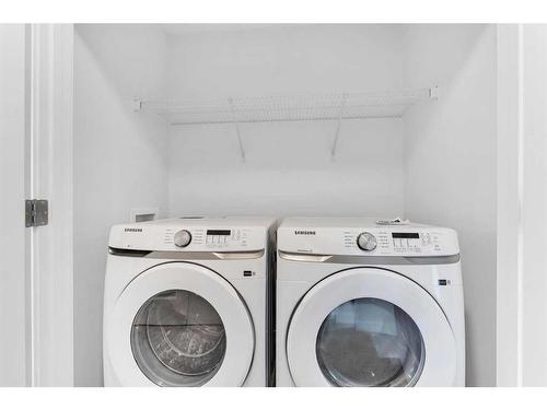 938 Cobblemore Common Sw, Airdrie, AB - Indoor Photo Showing Laundry Room