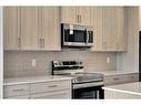 938 Cobblemore Common Sw, Airdrie, AB  - Indoor Photo Showing Kitchen With Upgraded Kitchen 