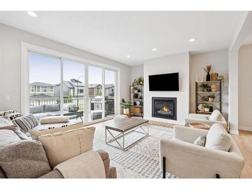 285 Sage Bluff Drive Nw, Calgary, AB - Indoor Photo Showing Living Room With Fireplace