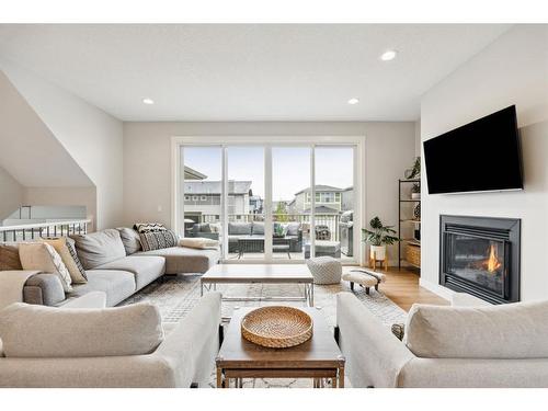 285 Sage Bluff Drive Nw, Calgary, AB - Indoor Photo Showing Living Room With Fireplace