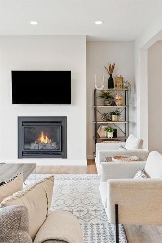 285 Sage Bluff Drive Nw, Calgary, AB - Indoor Photo Showing Living Room With Fireplace