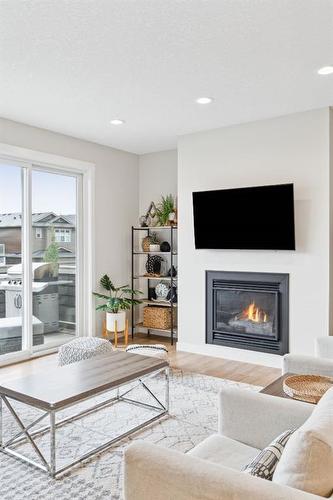 285 Sage Bluff Drive Nw, Calgary, AB - Indoor Photo Showing Living Room With Fireplace