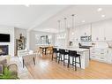 285 Sage Bluff Drive Nw, Calgary, AB  - Indoor Photo Showing Kitchen With Fireplace With Upgraded Kitchen 