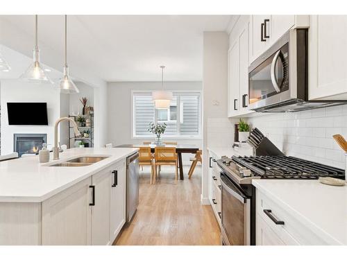 285 Sage Bluff Drive Nw, Calgary, AB - Indoor Photo Showing Kitchen With Double Sink With Upgraded Kitchen