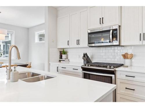 285 Sage Bluff Drive Nw, Calgary, AB - Indoor Photo Showing Kitchen With Double Sink With Upgraded Kitchen