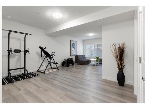 49 Lucas Heights Nw, Calgary, AB - Indoor Photo Showing Gym Room