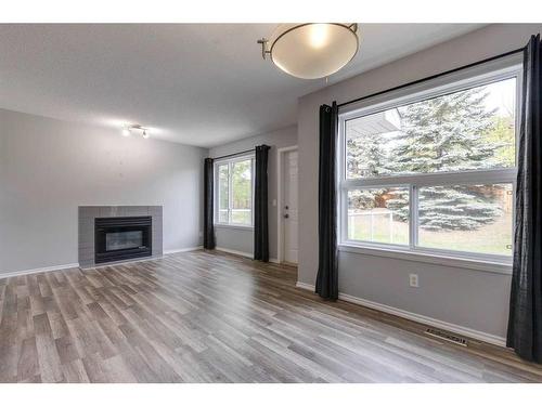 48 Catalina Circle Ne, Calgary, AB - Indoor Photo Showing Living Room With Fireplace