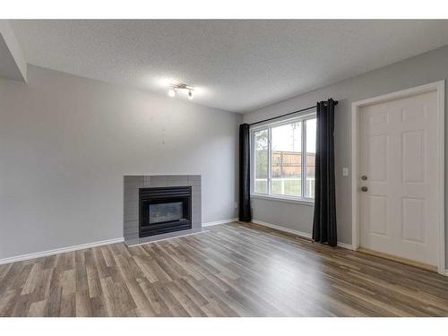 48 Catalina Circle Ne, Calgary, AB - Indoor Photo Showing Living Room With Fireplace