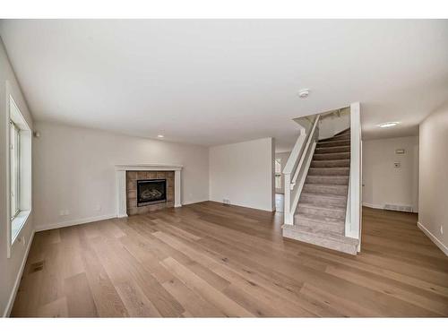 111 Cranwell Close Se, Calgary, AB - Indoor Photo Showing Living Room With Fireplace