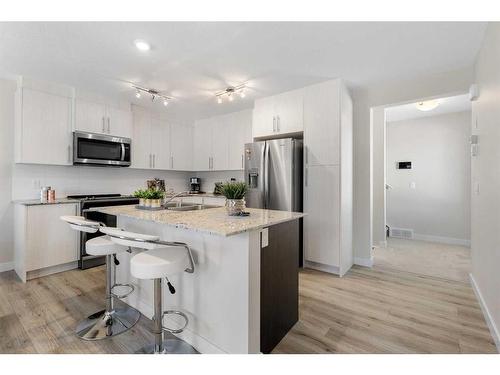 133 Sage Hill Grove Nw, Calgary, AB - Indoor Photo Showing Kitchen With Stainless Steel Kitchen With Double Sink With Upgraded Kitchen