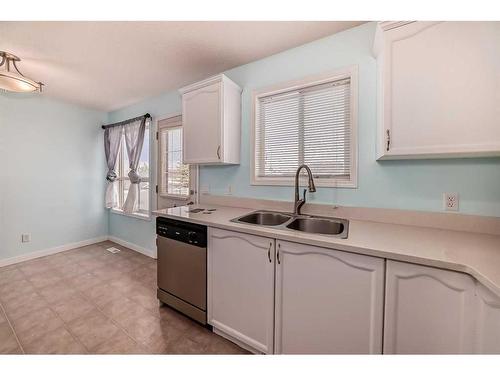 22 Hidden Hills Terrace, Calgary, AB - Indoor Photo Showing Kitchen With Double Sink