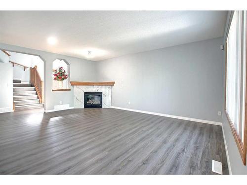 59 Panamount Lane Nw, Calgary, AB - Indoor Photo Showing Living Room With Fireplace