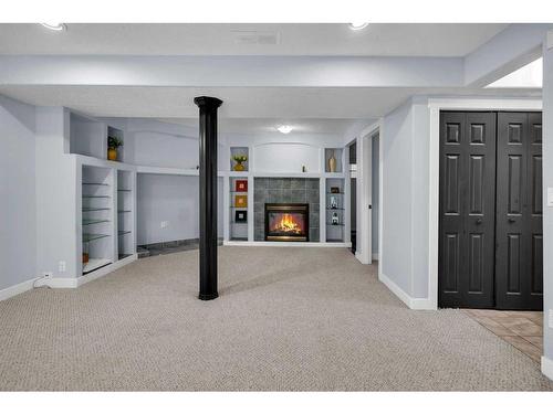 230 Coral Keys Court Ne, Calgary, AB - Indoor With Fireplace