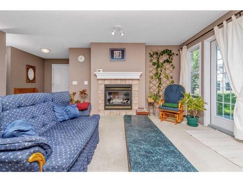 3105-7171 Coach Hill Road Sw, Calgary, AB - Indoor Photo Showing Living Room With Fireplace