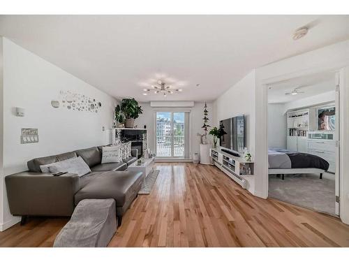 3211-10 Country Village Park Ne, Calgary, AB - Indoor Photo Showing Living Room With Fireplace