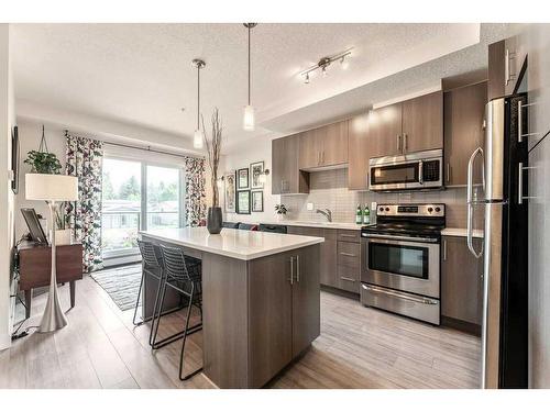 206-15233 1 Street Se, Calgary, AB - Indoor Photo Showing Kitchen With Upgraded Kitchen